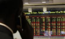 A stockbroker transacts shares during a trading session at the Nairobi Securities Exchange in Kenya's capital Nairobi, January 11, 2012. PHOTO BY REUTERS/Thomas Mukoya