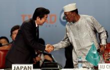 Japan's Prime Minister Shinzo Abe (L) greets Chairperson of the African Union (AU) and Chad's President Idriss Deby as they attend Sixth Tokyo International Conference on African Development (TICAD VI), in Kenya's capital Nairobi, August 27, 2016. PHOTO BY REUTERS/Thomas Mukoya