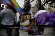 A participant holds a framed photograph of a transgender victim murdered in a hate crime during a march to mark the International Day Against Homophobia, Transphobia and Biphobia in Tegucigalpa, Honduras, May 17, 2018. PHOTO BY REUTERS/Jorge Cabrera
