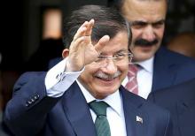 Turkey's Prime Minister Ahmet Davutoglu greets worshipers as he leaves a mosque after friday prayers in Ankara, Turkey, June 12, 2015. PHOTO BY REUTERS/Umit Bektas 