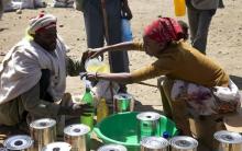 A man receives cooking oil at an emergency food aid distribution in the village of Estayish in Ethiopia's northern Amhara region, February 11, 2016. PHOTO BY REUTERS/Katy Migiro