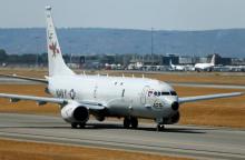 A U.S. Navy Poseidon P8 maritime surveillance aircraft taxis before taking off at Perth International Airport, March 28, 2014. PHOTO BY REUTERS/Jason Reed