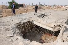 Iraq security forces gather at the site of a suspected air strike at a Shi'ite mosque during fighting in nearby Kirkuk last week in Daquq , Iraq, October 24, 2016. PHOTO BY REUTERS/Ako Rasheed