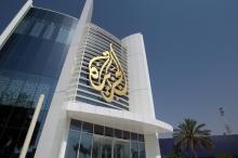 The Al Jazeera Media Network logo is seen on its headquarters building in Doha, Qatar, June 8, 2017. PHOTO BY EUTERS/Naseem Zeitoon