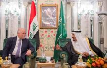 Saudi Arabia's King Salman bin Abdulaziz Al Saud (R) talks with Iraqi Prime Minister Haider al-Abadi in Jeddah, Saudi Arabia, June 19, 2017. PHOTO BY REUTERS/Bandar Algaloud/Courtesy of Saudi Royal Court