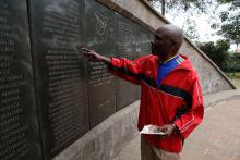 Ali Mwadama, a survivor of the 1998 U.S. Embassy bombing, looks for the names of his friends on the August 7th memorial wall in Nairobi, Kenya, August 5, 2018. PHOTO BY REUTERS/Baz Ratner