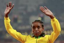 Ethiopia's first placed Almaz Ayana waves during the medals ceremony after the women's 5000 metres race at the 15th IAAF World Championships at the National Stadium in Beijing, China, August 30, 2015. PHOTO BY REUTERS/Kim Kyung-Hoon