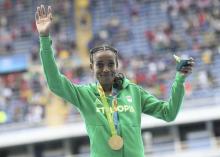 Gold medallist Almaz Ayana (ETH) of Ethiopia poses with her medal in Rio de Janeiro, Brazil, August, 12, 2016. PHOTO BY REUTERS/Alessandro Bianchi