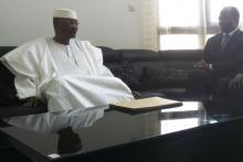 Mali's ousted President Amadou Toumani Toure (L) sits with Djibril Bassole, Burkina Faso's foreign minister and one of the leading mediators for West Africa's ECOWAS bloc, during a meeting in the capital Bamako