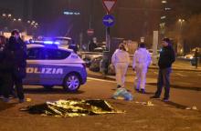 The body of Anis Amri, the suspect in the Berlin Christmas market truck attack, is seen covered with a thermal blanket next to Italian officers in a suburb of the northern Italian city of Milan, Italy, December 23, 2016. PHOTO BY REUTERS/Stringer