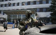 MANILA/SLAVIANSK, Ukraine (Reuters) - U.S. President Barack Obama announced new sanctions against some Russians on Monday to stop President Vladimir Putin from fomenting the rebellion in eastern Ukraine, but said he was holding broader measures against Russia's economy "in reserve."  On the ground, pro-Moscow rebels showed no sign of curbing their uprising, seizing public buildings in another town in the east. Interfax news agency reported that the mayor of a further major eastern city, Kharkiv, had been sh