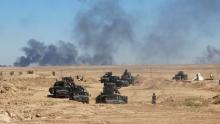 Iraqi security forces vehicles move toward the town of Hit during a military operation, in west of Ramadi, March 8, 2016. PHOTO BY REUTERS/Stringer