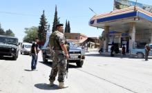 Lebanese army soldiers patrol a street at the entrance of the border town of Arsal, in eastern Bekaa Valley, Lebanon, June 30, 2017. PHOTO BY REUTERS/Hassan Abdallah