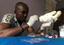 John Amanam, a 32-year-old former movie special effects expert, works on a prosthetic hand at his company, Immortal Cosmetic Art, in Uyo, Nigeria, January 7, 2020. PHOTO BY REUTERS/Seun Sanni