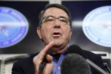 U.S. Secretary of Defense Ash Carter speaks during his first news conference since his swearing-in, aboard his plane en route to Afghanistan, February 20, 2015. PHOTO BY REUTERS/Jonathan Ernst