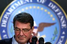 U.S. Defense Secretary Ash Carter pauses while speaking to reporters at a news conference after a regional security meeting at Camp Arifjan, February 23, 2015. PHOTO BY REUTERS/Jonathan Ernst