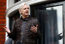WikiLeaks founder Julian Assange is seen on the balcony of the Ecuadorian Embassy in London, Britain, May 19, 2017. PHOTO BY REUTERS/Neil Hall