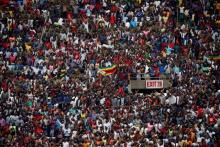 Crowds cheer at Emmerson Mnangagwa's presidential inauguration in Harare, Zimbabwe, November 24, 2017. PHOTO BY REUTERS/Siphiwe Sibeko