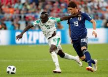 Senegal's Sadio Mane in action with Japan's Hiroki Sakai. PHOTO BY REUTERS/Max Rossi