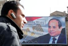 A man walks by a poster of Egypt's President Abdel Fattah al-Sisi from the campaign titled “Alashan Tabneeha” (So You Can Build It), for the upcoming presidential election in Cairo, Egypt, January 22, 2018. PHOTO BY REUTERS/Amr Abdallah Dalsh
