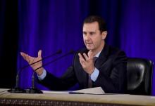 Syria's President Bashar al-Assad speaks during a meeting with members of the Central Bar Association in Damascus, in this handout picture provided by SANA on February 15, 2016. PHOTO BY REUTERS/SANA
