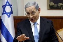 Israel's Prime Minister Benjamin Netanyahu gestures during the weekly cabinet meeting at his office in Jerusalem, June 14, 2015. PHOTO BY REUTERS/Gali Tibbon