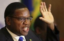 Bernard Membe, gestures as he speaks during a new conference in Harare, August 2, 2013. PHOTO BY REUTERS/Siphiwe Sibeko