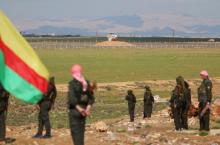 Kurdish members of the Self-Defense Forces stand near the Syrian-Turkish border in the Syrian city of al-Derbasiyah during a protest against the operations launched in Turkey by government security forces against the Kurds, February 9, 2016. PHOTO BY REUTERS/Rodi Said