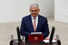 Turkey's new Prime Minister Binali Yildirim reads his government's programme at the Turkish parliament in Ankara, Turkey, May 24, 2016. PHOTO BY REUTERS/Umit Bektas