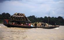 People travel on a locally built passenger boat loaded with oil containers through a creek on the River Nun in Nigeria's oil state of Bayelsa, December 6, 2012. PHOTO BY REUTERS/Akintunde Akinleye