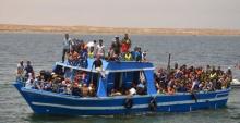 Illegal migrants are seen on a boat after being rescued by the Tunisian navy off the coast near Ben Guerdane, Tunisia, June 10, 2015. PHOTO BY REUTERS/Stringer