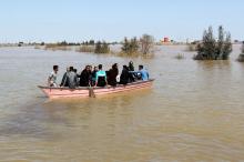 People are seen on a boat after a flooding in Golestan province, Iran, March 24, 2019. PHOTO BY REUTERS/Tasnim News Agency