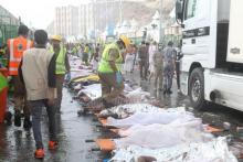 The bodies of Muslim pilgrims are laid on stretchers after a stampede at Mina, outside the holy Muslim city of Mecca, September 24, 2015. PHOTO BY REUTERS/Stringer