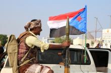 A bodyguard of a southern Yemeni separatist leader holds an RPG launcher as he rides on the back of a pick-up truck at the site of an anti-government protest in Aden, Yemen, January 28, 2018. PHOTO BY REUTERS/Fawaz Salman