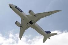 Boeing 787 Dreamliner belonging to Polish airline LOT flies after taking off from the Chopin International Airport in Warsaw, June 1, 2013. PHOTO BY REUTERS/Kacper Pempel