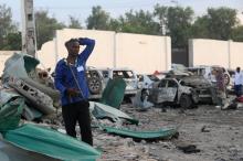 A security officer from Doorbin Hotel assesses the debris after a suicide car explosion in front of the hotel. PHOTO BY REUTERS/Feisal Omar