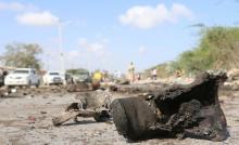 A military boot is seen at the scene of a suicide car bomb attack by al Shabaab in Somalia's capital Mogadishu, Somalia, September 18, 2016. PHOTO BY REUTERS/Feisal Omar