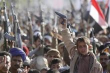 A boy shouts slogans as he raises a gun during a rally against U.S. support to Saudi-led air strikes, in Yemen's capital Sanaa, February 19, 2016. PHOTO BY REUTERS/Mohamed al-Sayaghi