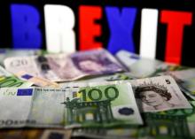 Euro and Pound banknotes are seen in front of BREXIT letters in this picture illustration taken April 28, 2017. PHOTO BY REUTERS/Dado Ruvic/Illustration