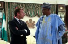 French President Emmanuel Macron speaks with Nigeria's President Muhammadu Buhari at the Presidential State House in Abuja, Nigeria, July 3, 2018. PHOTO BY REUTERSLudovic Marin/Pool