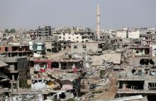 Buildings which were damaged during the security operations and clashes between Turkish security forces and Kurdish militants, are pictured in Nusaybin, a district of Turkey's southeastern province of Mardin on the Syrian border, Turkey, July 25, 2016. PHOTO BY REUTERS/Sertac Kayar