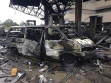 The charred wreckage of a minivan is seen at a gas station that exploded overnight in Accra, Ghana, June 4, 2015. PHOTO BY REUTERS/Matthew Mpoke Bigg