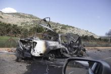 A burnt vehicle is seen near the village of Ghajar on Israel's border with Lebanon, January 28, 2015. PHOTO BY REUTERS/Maruf Khatib