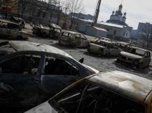 Burnt-out vehicles are seen at a residential sector in Mariupol, a city on the Sea of Azov, eastern Ukraine, February 3, 2015. PHOTO BY REUTERS/Gleb Garanich