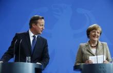 German Chancellor Angela Merkel and Britian's Prime Minister David Cameron address a joint news conference following a meeting at the Chancllery in Berlin, Germany, May 29, 2015. PHOTO BY REUTERS/Hannibal Hanschke