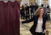 Nathalie Kosciusko-Morizet, conservative UMP political party candidate for the mayoral election, exits the voting booth as she arrives to cast her ballot at a polling station in Paris