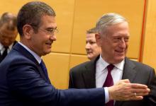 U.S. Secretary of Defence Jim Mattis poses with Turkish Defence Minister Nurettin Canikli during a NATO defence ministers meeting at the Alliance headquarters in Brussels, Belgium, February 14, 2018. PHOTO BY REUTERS/Virginia Mayo