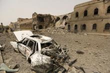 A car destroyed during a Saudi-led air strike is seen outside the Defence Ministry compound in Yemen's capital Sanaa, June 10, 2015. PHOTO BY REUTERS/Khaled Abdullah