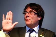 Catalonia's former leader Carles Puigdemont gestures during a news conference in Berlin, Germany, April 7, 2018. PHOTO BY REUTERS/Hannibal Hanschke