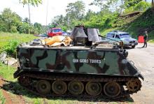 A government soldier in an armoured personnel carrier stands on guard at a checkpoint along a main highway in Pantar town, Lanao del Norte, after residents started to evacuate their hometown of Marawi city, southern Philippines, May 24, 2017. PHOTO BY REUTERS/Romeo Ranoco